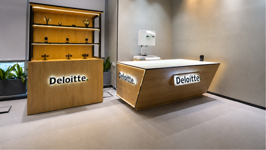 Deloitte retail experience center with interactive product table and branded display area